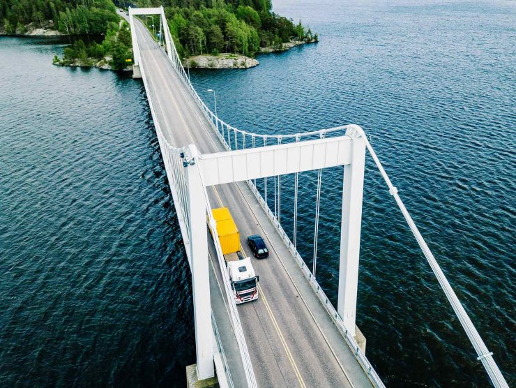 aerial-view-of-white-suspension-bridge-with-car-cr-93U58A5.jpg